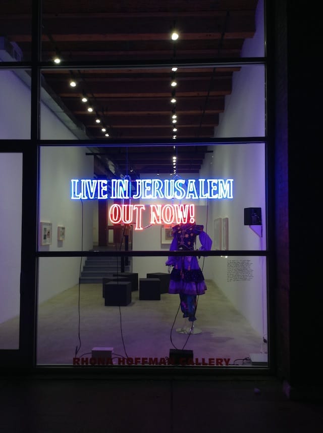 Michael Rakowitz, "Live in Jerusalem, Out Now!" 2014. Neon, 23 x 72 inches.