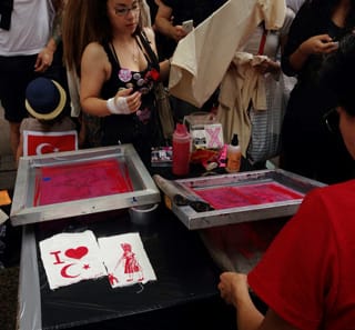 OWS Screenprinters printing tshirts in Zuccotti Park for the Occupy Gezi protest in lower Manhattan. (photo by the author for Hyperallergic)