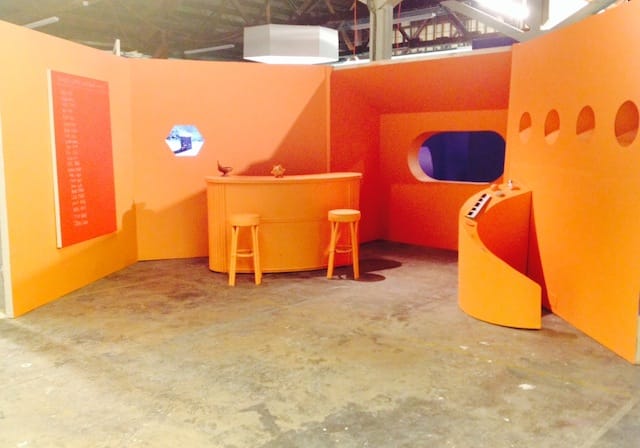 Set from Scott Reeder's production MOON DUST, including the painting "Untitled (Three Letter Band Names" 2014