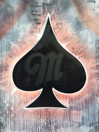 Detail of Risk's mural, with the blacked-out but still clearly visible Miller Fortune logo (click to enlarge)