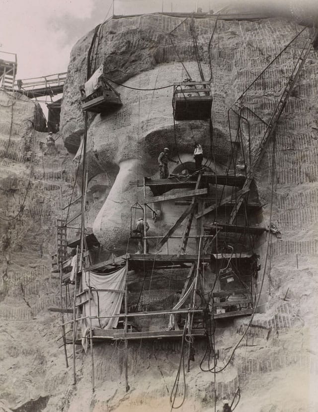 Acme Photography Bureau, "Carving Lincoln on Rushmore Granite" (1937), gelatin silver print with mimeograph (Collection of Alan Lloyd Paris)