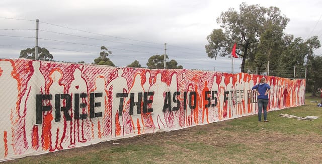 A banner in Melbourne protesting Australia's treatment of refugees and asylum seekers. ASIO stands for Australian Security Intelligence Organisation.