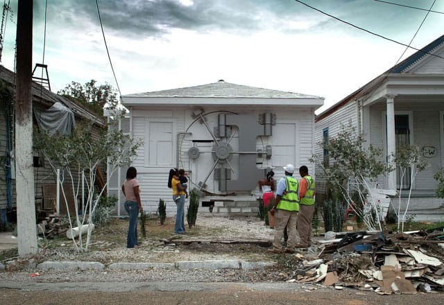 Mel Chin, "Safehouse", 2008-2010; existing house, stainless steel, steel, wood, plywood, Gatorboard ®, lead-encapsulation paint, automotive body and paint finishes, 12,000 brass thumbtacks, 6,000 unique hand-drawn Fundred Dollar Bills; installation view on N. Villere St. in New Orleans - via melchin.org