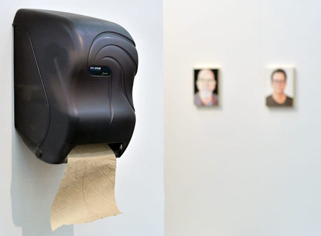 Andrew Ohanesian's "" (2014) with Jim Torok's paintings of Chuck Close and Fred Tomaselli (both 2014) in the background, at Pierogi Gallery