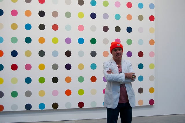Damien Hirst at his Gagosian 'Complete Spot Paintings' show in 2012 (image via Andrew Russeth/16 Miles of String on Flickr) 