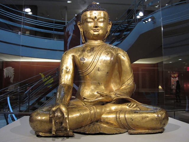 "Medicine Buddha Bhaishajyaguru" (14th or early 15th century), gilded and painted copper, Central Tibet