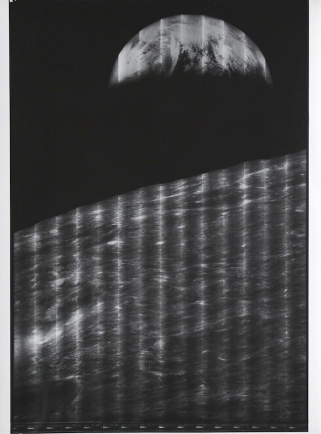 LUNAR ORBITER I.  THE FIRST IMAGE OF THE EARTH AS SEEN FROM THE MOON.  Silver gelatin print, 13½ by 10½ inches, on Kodak paper. August 23, 1966.  Est. $1,000-2,000 