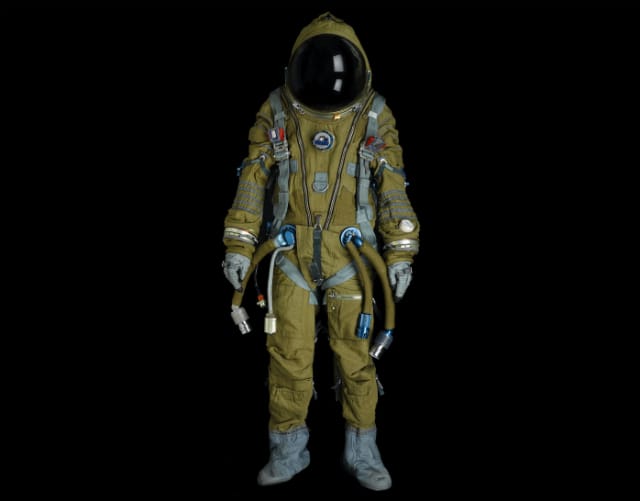 SOVIET FULL PRESSURE STRIZH RESCUE SPACESUIT.  Full pressure spacesuit, manufactured by NPP Zvedza, ca. 1988.  Olive flame-retardant nylon canvas with light blue and silver trim, inner pressure bladder of Kapron and resin, approximately 65 inches tall.  Est. $15,000-20,000 
