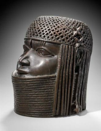 This work by an unidentified artist, "Commemorative head of a king (Oba)," Edo peoples, Benin kingdom, Nigeria (late 16th century), copper alloy, iron, 9 1/2 x 6 1/2 in (24.1 x 16.5 cm), is currently on view at the Museum of Fine Arts, Boston, but Nigeria wants it back. (image via mfa.org)