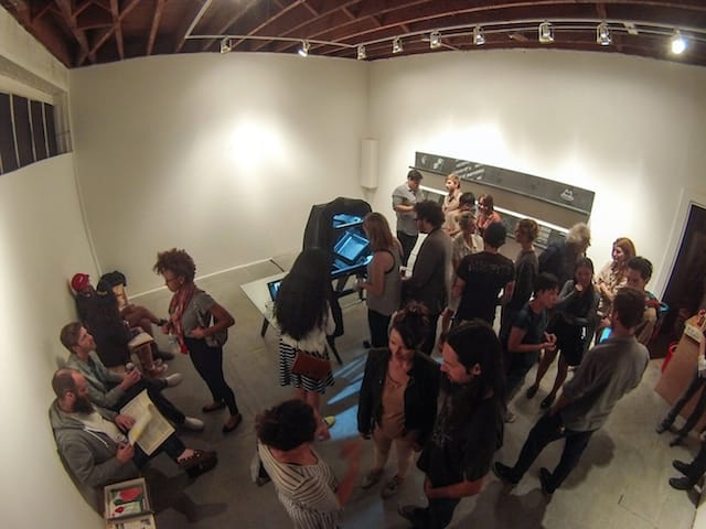 A security camera records the opening night of neverhitsend's event, "post-private." 