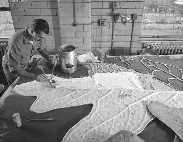 Rota, Alex J., “Ray De Lucia making giant oak leaf, Preparation Department, 1956,