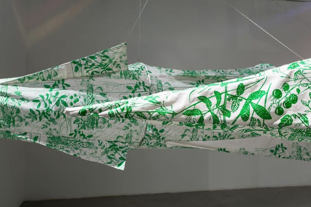 A detail of Gast's printed fabric on one of the two missile sculptures.