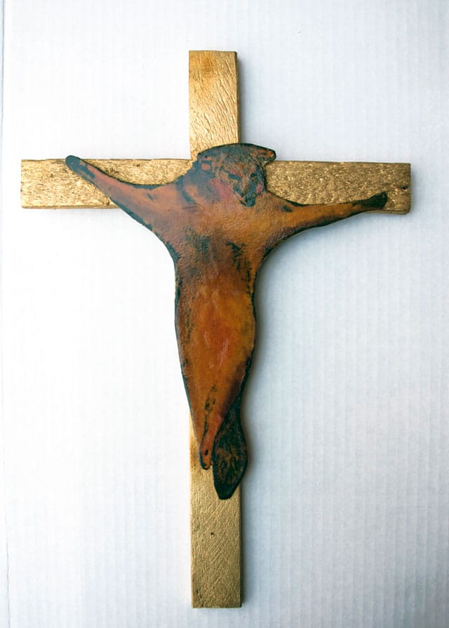 Paulette Nenner, "Crucified Coyote" (c. 1981), hand-colored photograph on board attached to gold-painted wood, 16 1/4 x 11 in (courtesy Gallery 98)