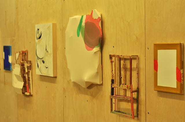 Various art works, including (bulging canvas at center) Maria Walker, "March 2014" (2014), and to its left, Lauren Collings, "Companions" (2013)
