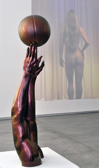 A work by Hank Willis Thomas (foreground) and Michael Snow (background) at The School.