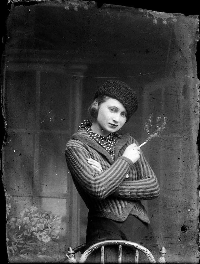 A woman with a cigarette in the studio (via Costică Acsinte Archive)