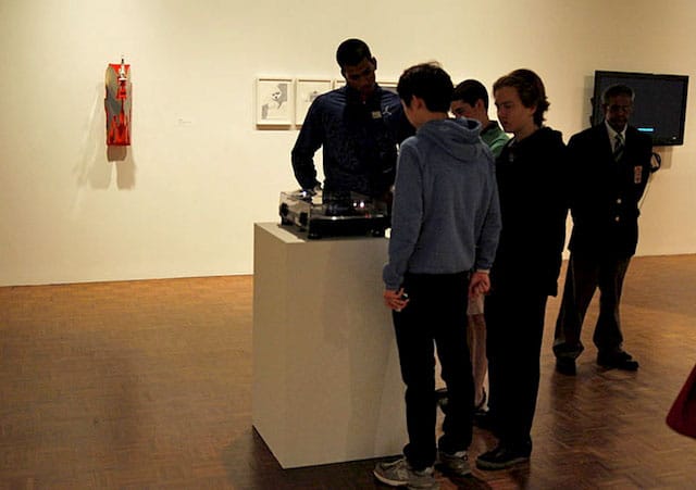 Museum visitors playing a vinyl record by Academy Records and Matt Hanner (photo by the author for Hyperallergic) (click to enlarge)