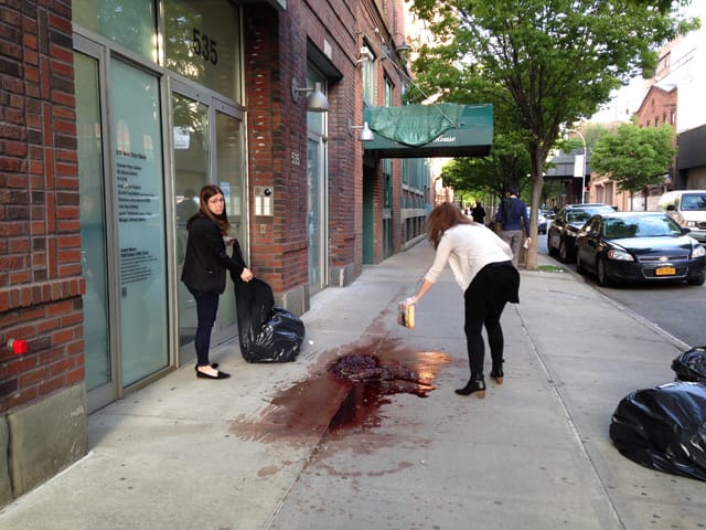 Women from Dia attempting to clean up the mess