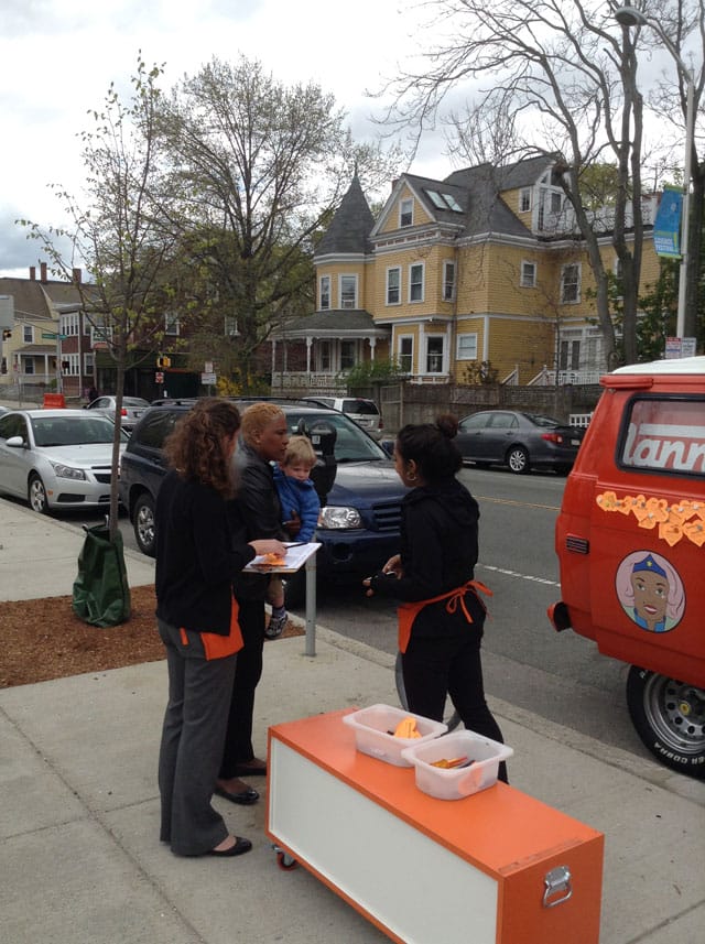 A member of the NannyVan team speaking with a nanny