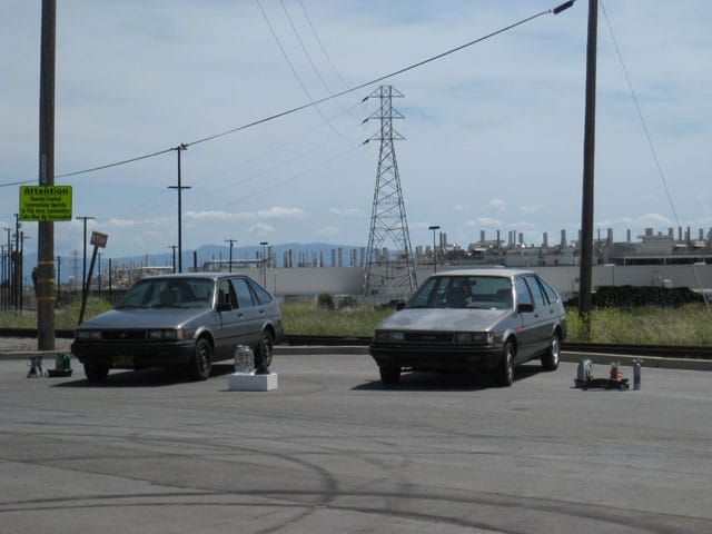 Two first-generation NUMMI cars ready for battle in Jesse Sugarmann's performance (all photos by the author for Hyperallergic)