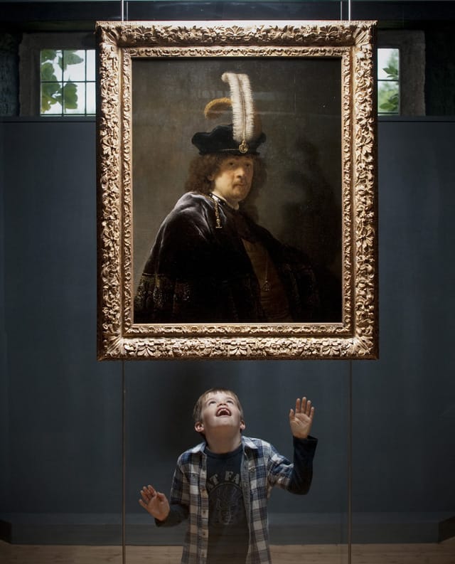 Some 8-year-old kid thrilled he's looking at a real Rembrandt, obviously (image by Steven Haywood, courtesy National Trust/PA)