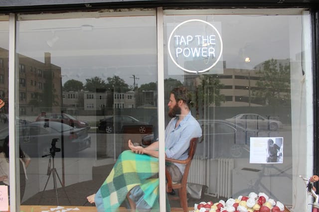 Kent sits in the window with his newly sprouted seed