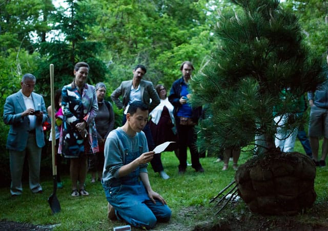 Terence Koh reading a haiku at the dedication of his