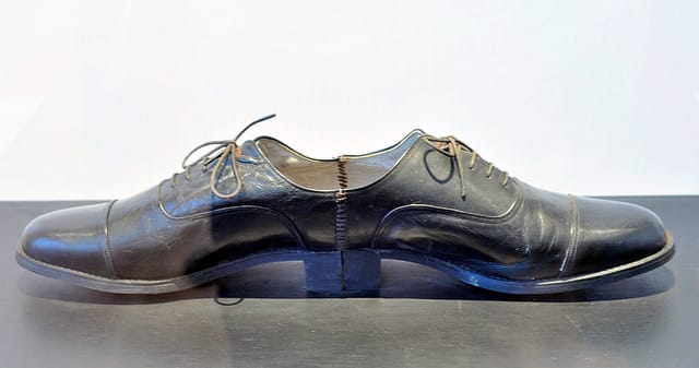 Ai Weiwei, "One Man Shoe" (1987), wood board, leather, shoes