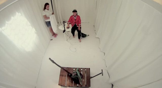 A bidder views an artwork at the Kosta Boda emotions auction (screenshot via YouTube)