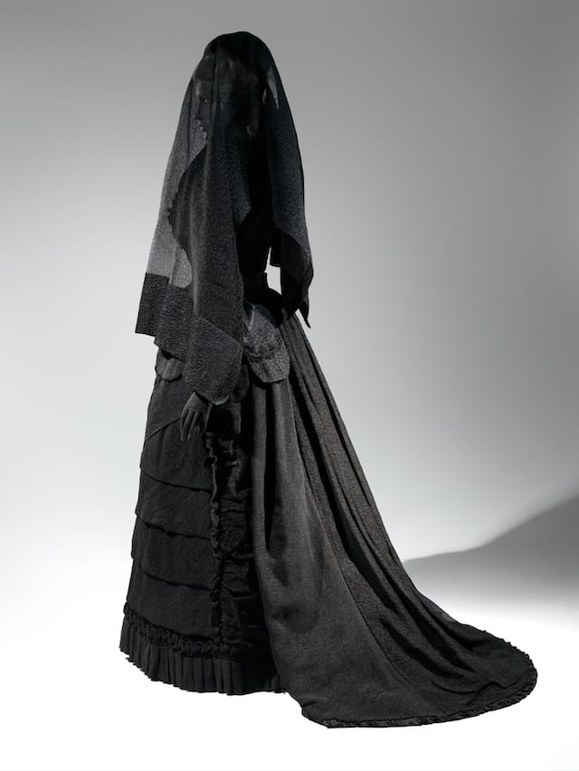 Mourning Ensemble, 1870-1872 Black silk crape, black mousseline The Metropolitan Museum of Art, Brooklyn Museum Costume Collection at The Metropolitan Museum of Art, Gift of the Brooklyn Museum, 2009; Gift of Martha Woodward Weber, 1930 (2009.300.633a, b) Veil, ca. 1875 Black silk crape The Metropolitan Museum of Art, Gift of Roi White, 1984 (1984.285.1) Photo: © The Metropolitan Museum of Art, by Karin Willis