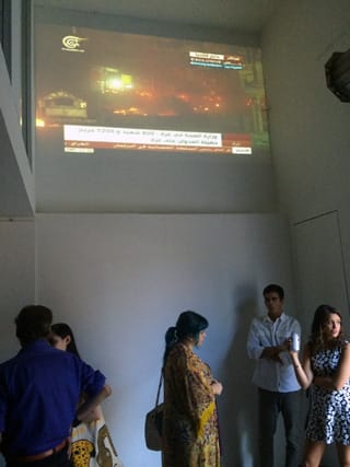 Al Jazeera's Arabic-language cable news channel was being broadcast in Whitebox Art Center during the "No Exit" opening.