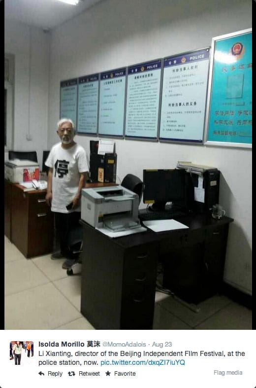 AP reporter Isolda Morillo tweeted this photo of Beijing Independent Film Festival organizer Li Xianting at the police station (via Twitter/@MomoAdalois) (click to enlarge)