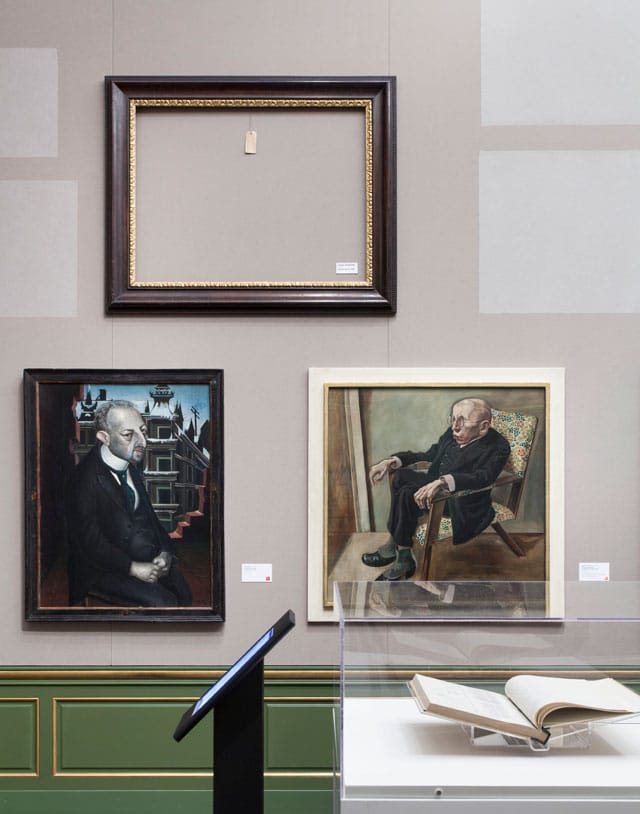 Installation view, 'Degenerate Art: The Attack on Modern Art in Nazi Germany, 1937' at Neue Galerie, with 'Entartete Kunst' manuscript visible at bottom right