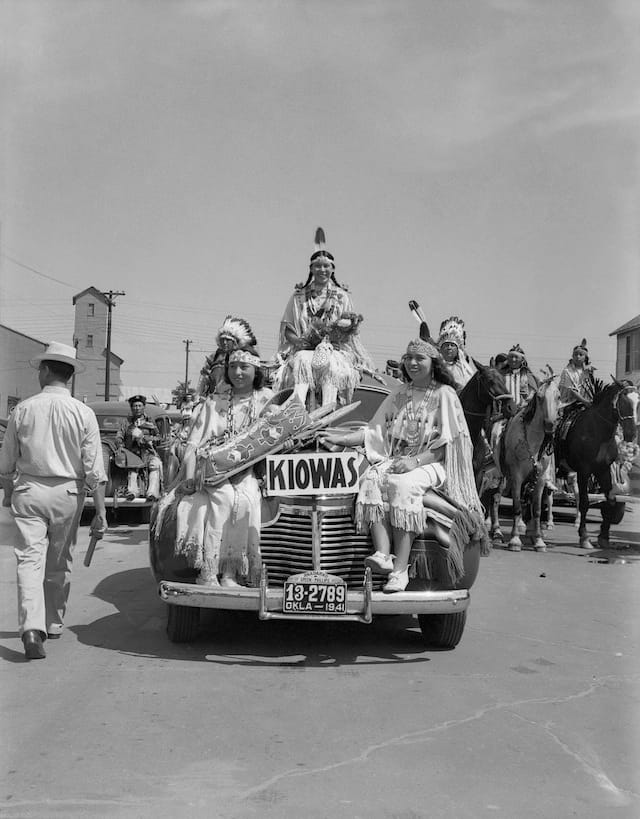 Caption: Left to right: Juanita Daugomah Ahtone (Kiowa), Evalou Ware Russell (center), Kiowa Tribal Princess, and Augustine Campbell Barsh (Kiowa) in the American Indian Exposition parade. Anadarko, Oklahoma, 1941. 45EP9 Tom Jones 2 1/2 hours of cleaning