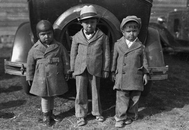 Caption: Left to right: Newton Poolaw (Kiowa), Jerry Poolaw (Kiowa), Elmer Thomas “Buddy” Saunkeah (Kiowa). Mountain View, Oklahoma, ca. 1928. 57FK1