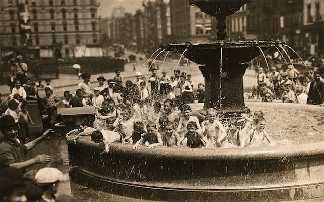 Newspaper boys in an NYC fountain (April 1916) (photograph by Edwin Levick, National Geographic Creative)
