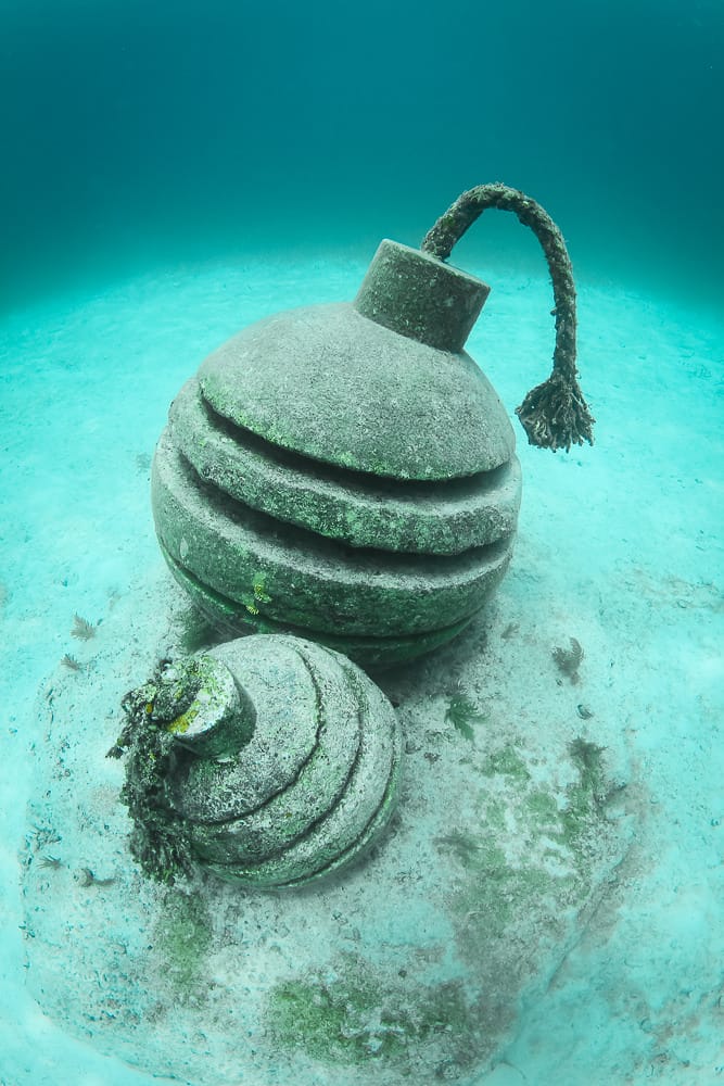 Ticking time bomb sculptures by Jason de Caires Taylor (image courtesy the artist) (click to enlarge)