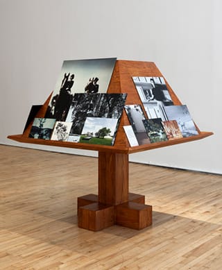 Jill Magid, "Der Trog" (2013), from her installation Facistol (pine lectern inspired by Luis Barragán, mounted reproductions from Luis Barragán’s personal archive), architectural model, as it was exhibited at Art in General during Performa 13. (photo by Steven Probert, via artingeneral.org)