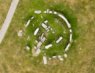 An aerial photograph of Stonehenge by Damian Grady. The images were commissioned following grass discoloration caused by a faulty hose pipe. A new report suggests that the monument may have once been a perfect circle (courtesy English Heritage)