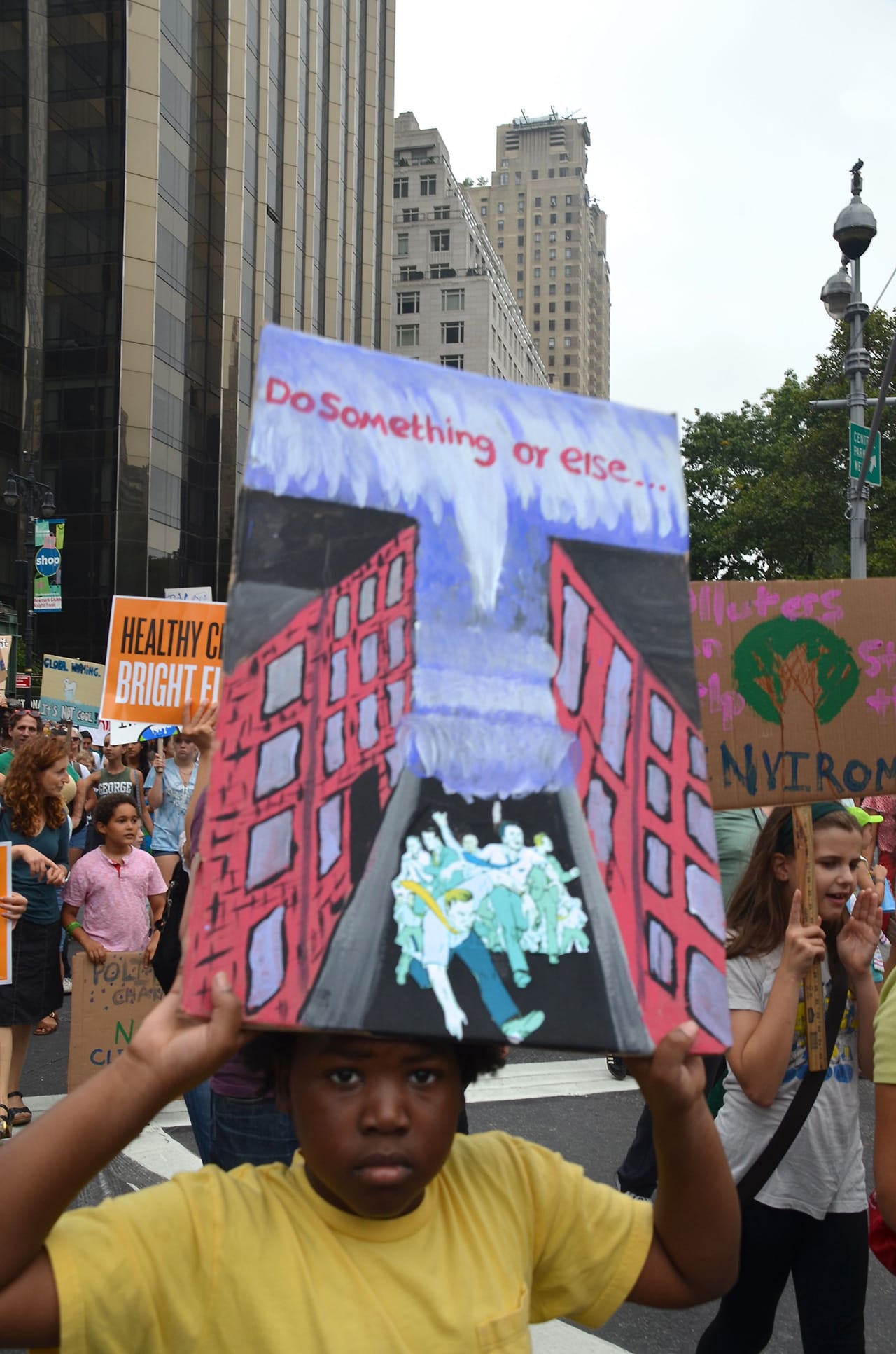 Caleb-age-holding-sign-of-tsunmai-comic-fan-1280