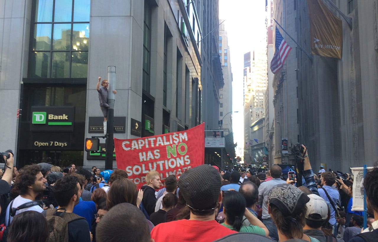 Man throwing money (photo by Hrag Vartanian/Hyperallergic)