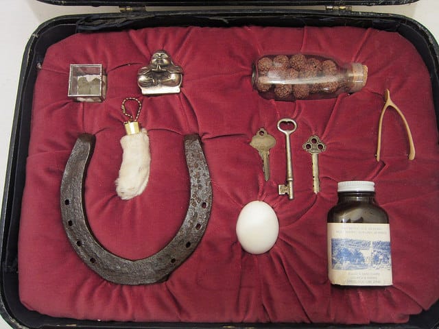 Jackie Mock, "Good Luck (For the Road)," vintage suitcase with good luck charms from around the world