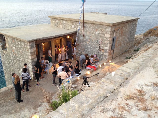 The crowd at the Deste Foundation Project Space Slaughterhouse at the opening of Pawel Althamer's 'The Secret of the Phaistos Disc' (all photos by the author for Hyperallergic)