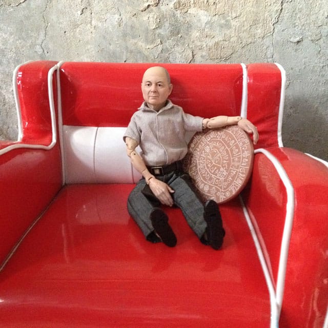 Pawel Althamer's doll of Dakis Joannou holding a replica of the Phaistos Disc