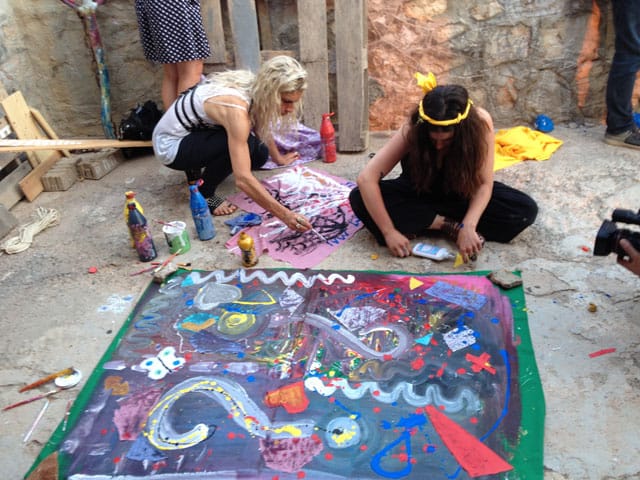 Visitors making art in Pawel Althamer's 'The Secret of the Phaistos Disc'