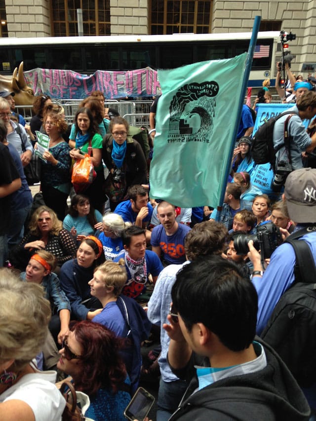 Protesters sitting down on Broadway (photo by Mostafa Heddaya/Hyperallergic)
