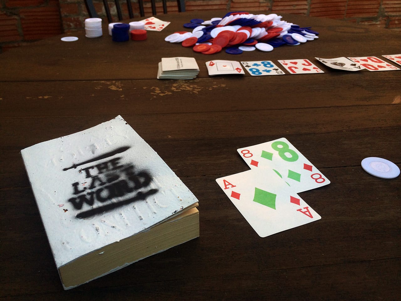 On the poker table inside the saloon