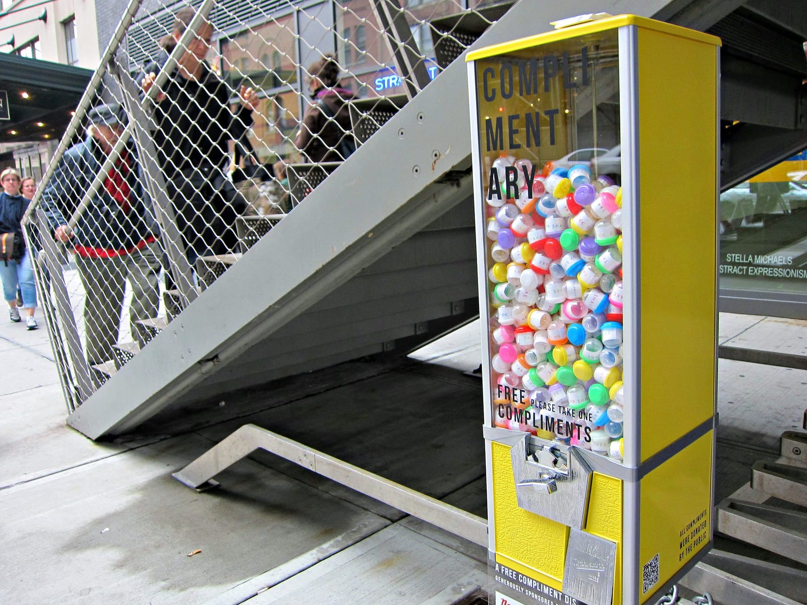 Leah Harper's "Complimentary" gumball machine installed by the High Line entrance on 14th Street