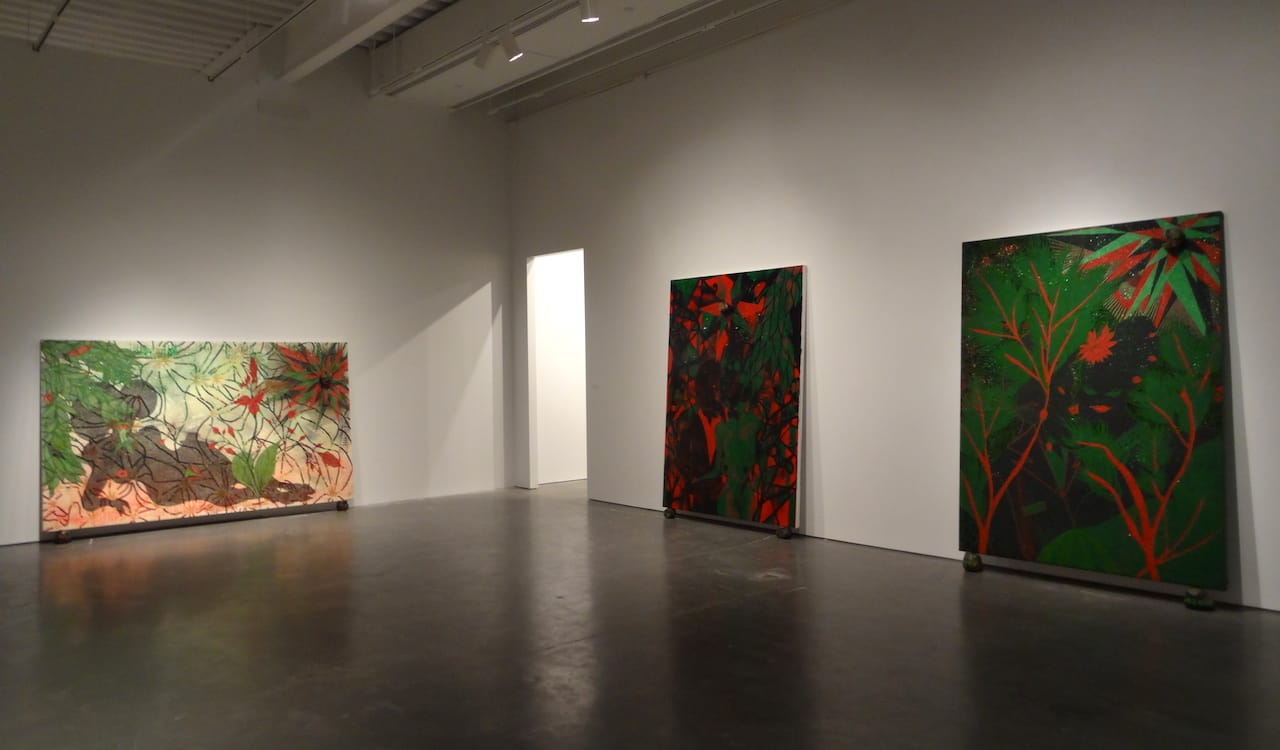 Installation view of 'Chris Ofili: Night and Day' with "Triple Beam Dreamer" (2001–02, at left), "Afro Green" (2005–08, at center), and "Afro Jezebel" (2002–03, at right)