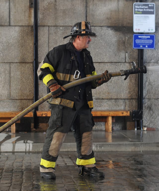 Retired firefighter John Riker performed opposite Dread Scott.